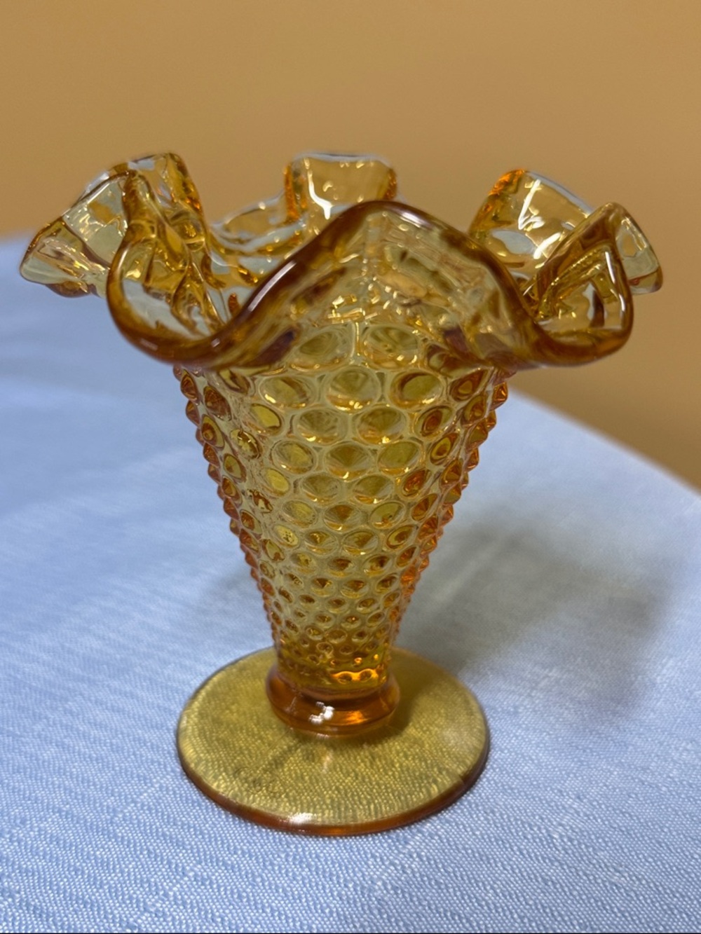 Fenton amber hobnail ruffled 4” vase